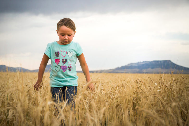 Girl standing in a field